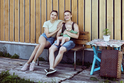 Young woman sitting on chair