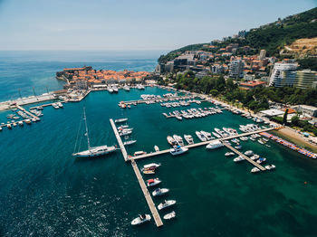 High angle view of harbor and buildings in city