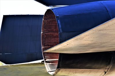 Close-up of old boat against blue sky