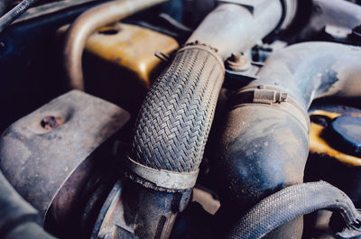 Low section of man repairing car