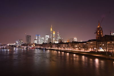 Illuminated city at waterfront