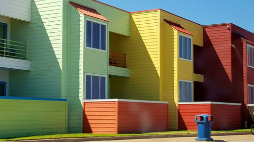 Multi colored building against blue sky