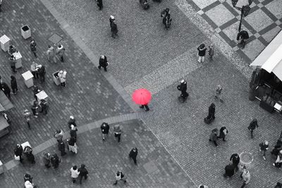 High angle view of people walking on street in city