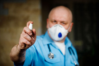 Portrait of man wearing mask