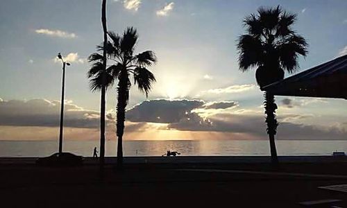 Scenic view of sea against cloudy sky