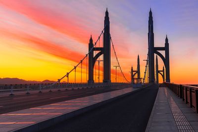 Bridge against orange sky