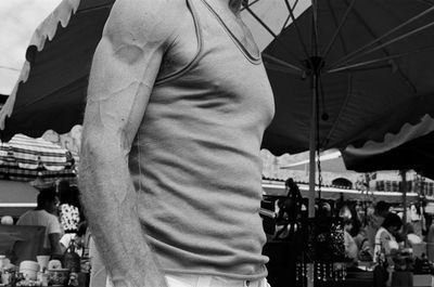 Midsection of man standing outdoors