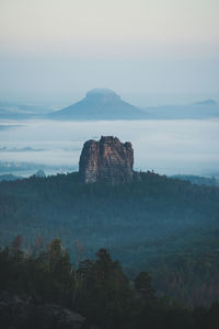 Rock formations on landscape against sky