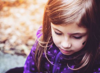 Close-up of girl looking down