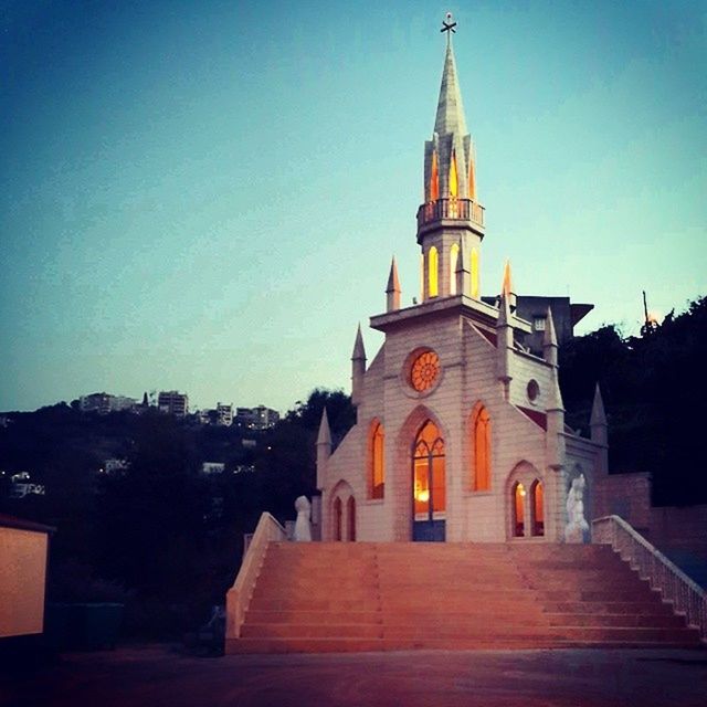 architecture, built structure, building exterior, religion, place of worship, church, spirituality, clear sky, blue, sky, the way forward, copy space, cross, outdoors, house, no people, low angle view, sunlight