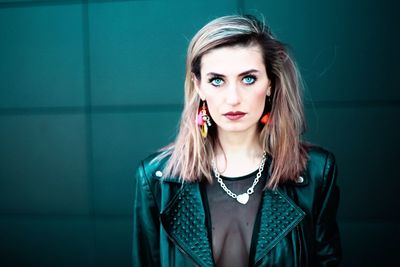 Close-up portrait of beautiful woman wearing leather jacket