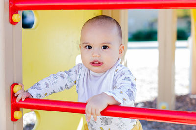 Portrait of cute boy playing in playground