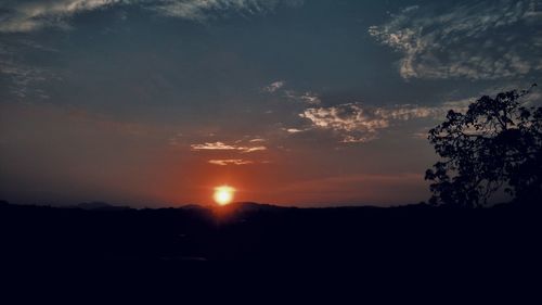 Scenic view of silhouette landscape against sky during sunset