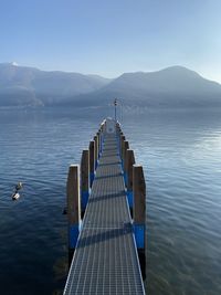 Pier on lake against sky