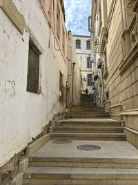 Alley amidst buildings in city