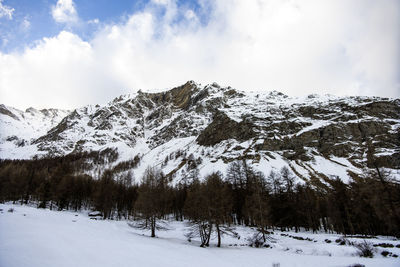 Scenic view of snowcapped mountains against sky