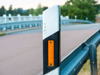 Close-up of railing by road