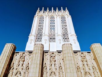 Low angle view of historical building against clear blue sky