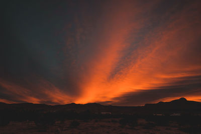 Sunrise in new mexico, mountain range, clouds.