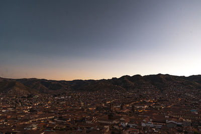 Aerial view of townscape against clear sky