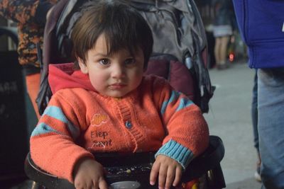 Boy sitting on street