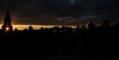 Silhouette of buildings at sunset