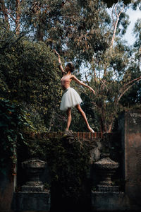 Young professional ballerina posing outdoors