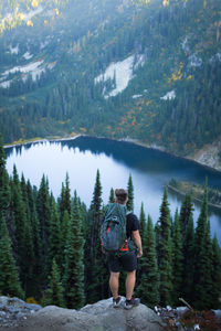 Rear view of man walking on mountain