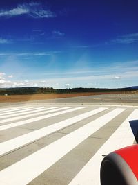 View of airplane on runway against sky