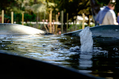 Close-up of hands in water