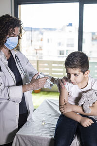 Little boy getting vaccinated from covid-19