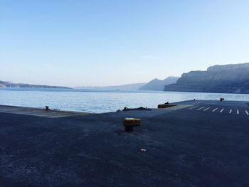 Boats in sea against clear sky