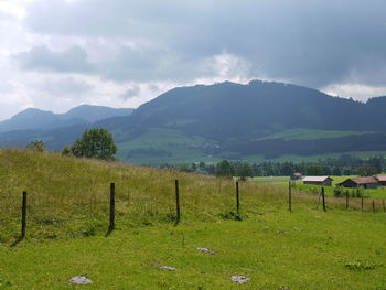 Scenic view of field against mountains