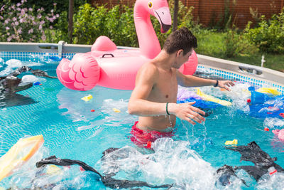 High angle view of man swimming in pool