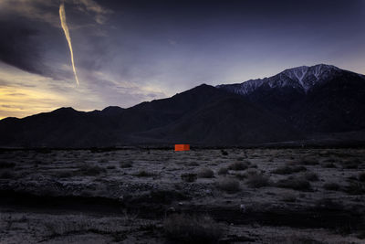 Scenic view of mountains against sky at sunset