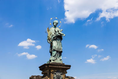 Patron saint nepomuk sculpture on the charles bridge in the prague, czech republic