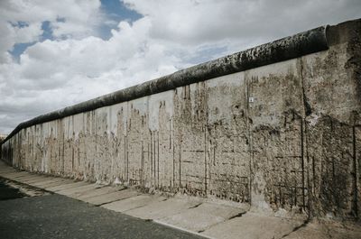 Wall of old building against sky