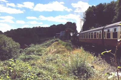 Train on railroad track against sky