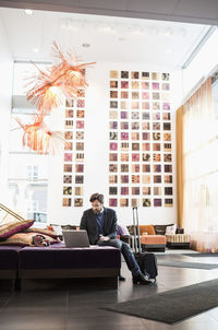 Man sitting in front of office building