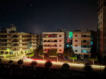 Buildings against sky in city at night