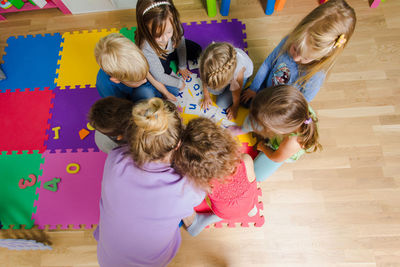 High angle view of people standing on floor