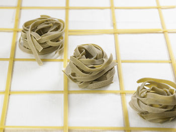High angle view of pastas on fabric