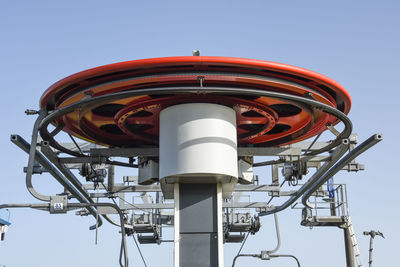 Low angle view of communications tower against clear sky