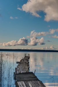 Pier on lake against sky