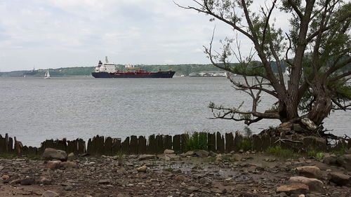 Scenic view of sea against cloudy sky