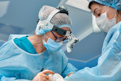 Surgeons doing surgery at hospital