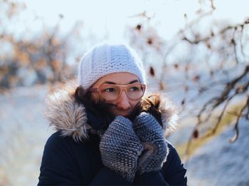 Portrait of smiling young woman during winter