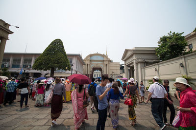 People on street against clear sky