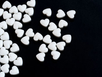 High angle view of candies against black background