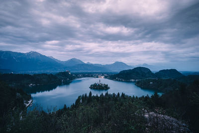 Scenic view of lake against cloudy sky